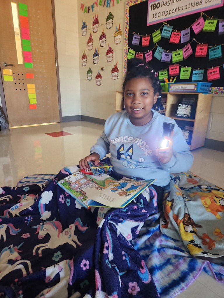 student reading by flashlight