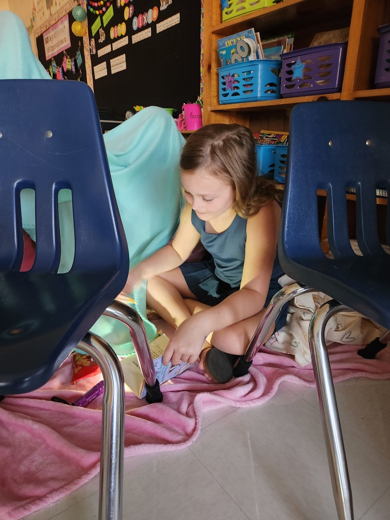 student reading by flashlight