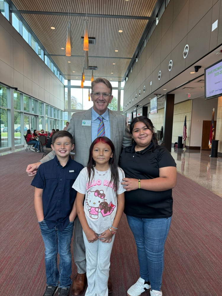 Dr. Travis L. Reeves poses with the SAVE Promise Club from FRES