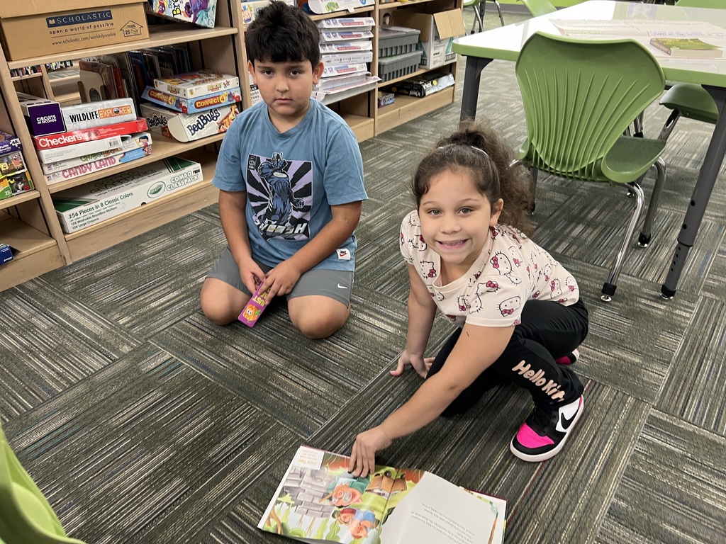students working together to find characteristics of Fairy Tales. 