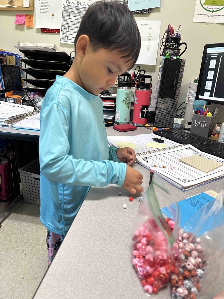 Kindergarten students have been learning how to be a good friend. Today, they made friendship bracelets together as a team-building activity.