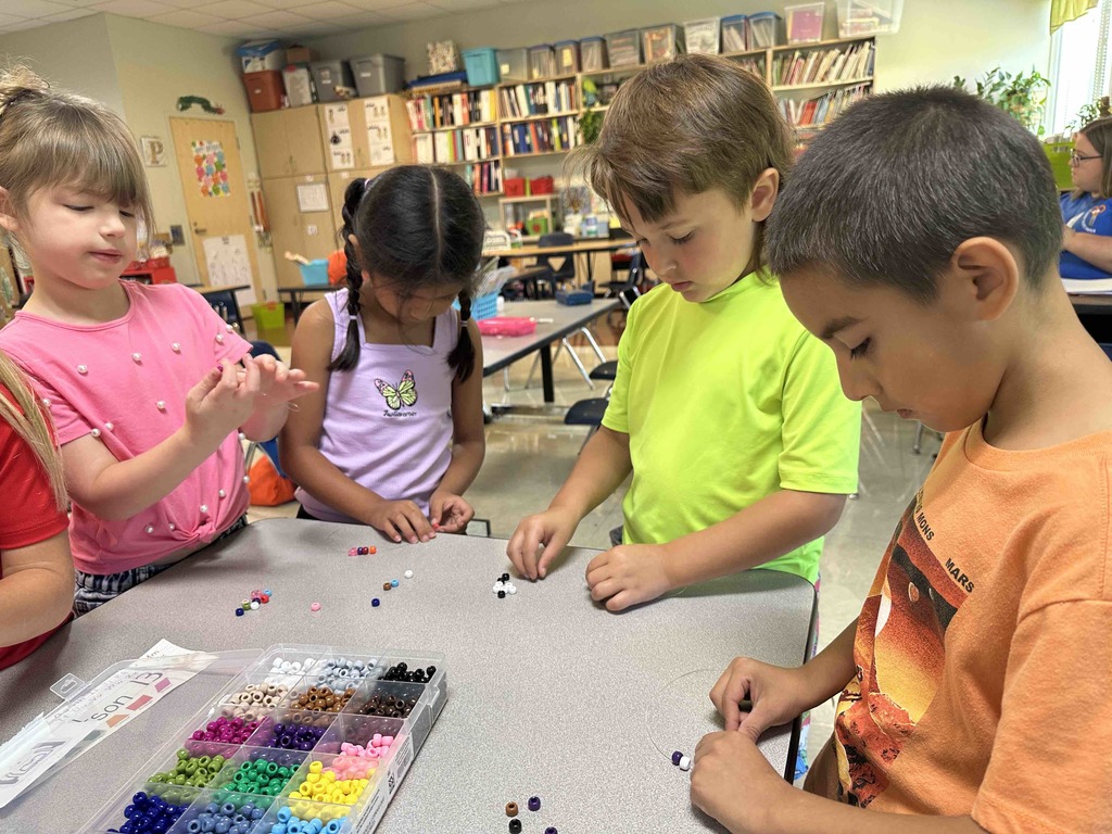 Kindergarten students have been learning how to be a good friend. Today, they made friendship bracelets together as a team-building activity.