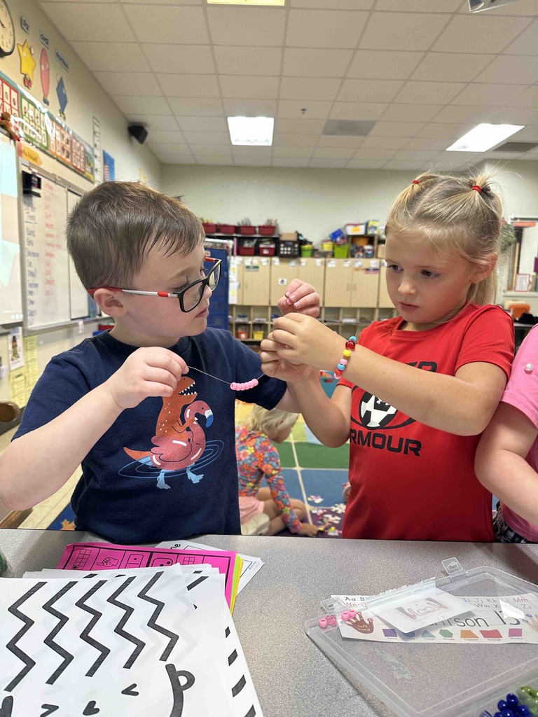 Kindergarten students have been learning how to be a good friend. Today, they made friendship bracelets together as a team-building activity.