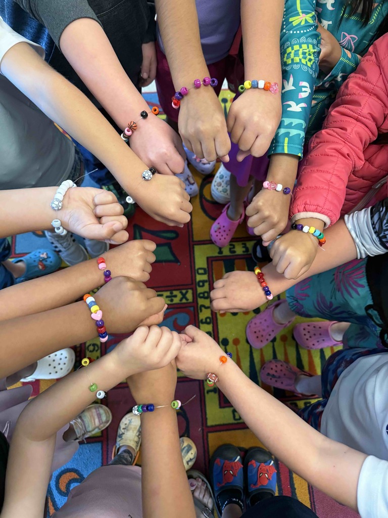 Kindergarten students have been learning how to be a good friend. Today, they made friendship bracelets together as a team-building activity.