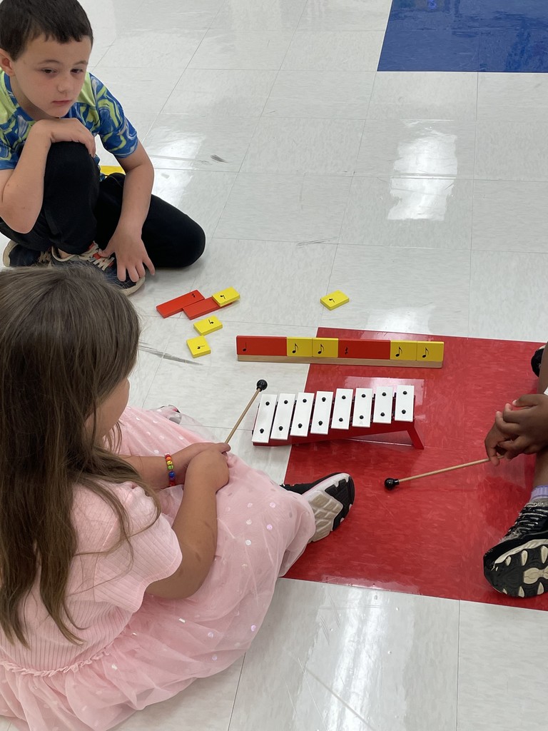 students playing bells