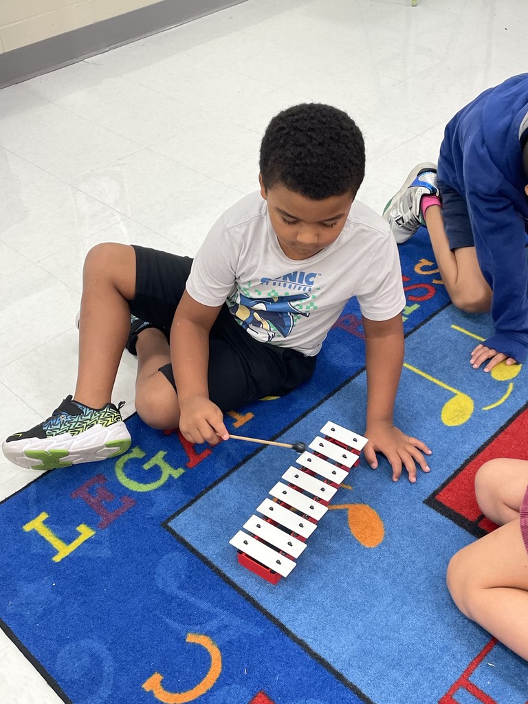 student playing bells