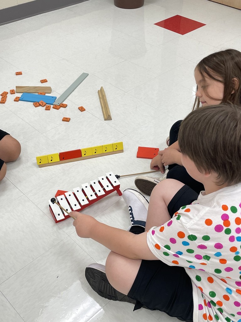 students playing the bells