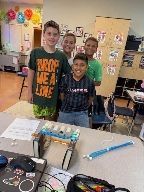 Our fifth graders were up to the challenge of building a bone bridge that would hold 200 grams and span 15-20 centimeters!  