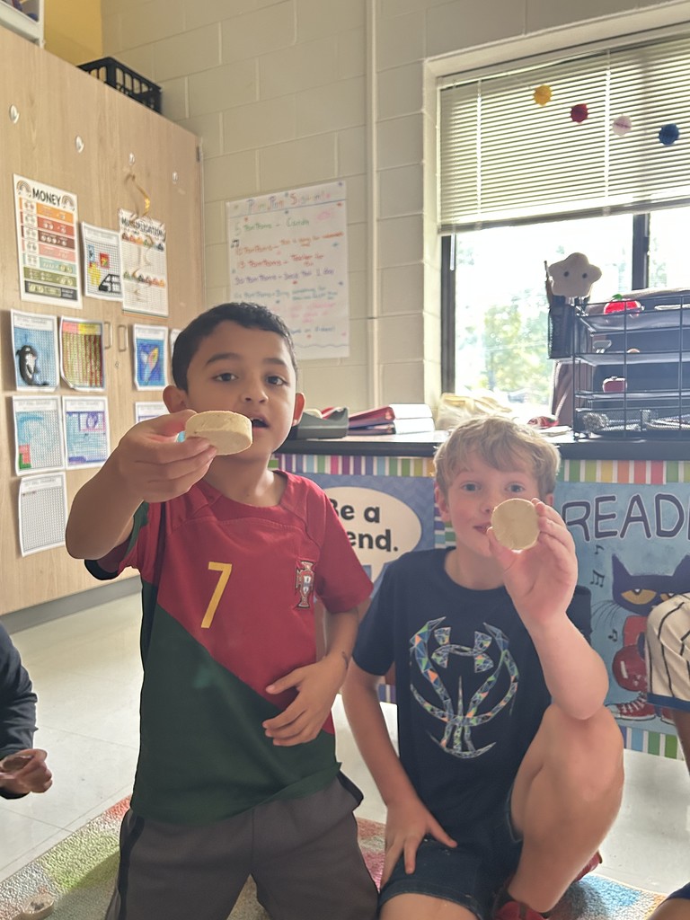 students showing the food they tried