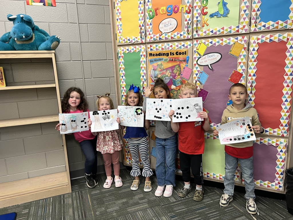 Kindergarten showing off the dots they made.