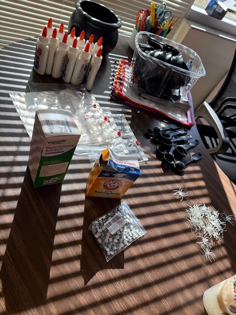 The Science Club was brewing during their October meeting. They made glow in the dark slime while learning about polymers!