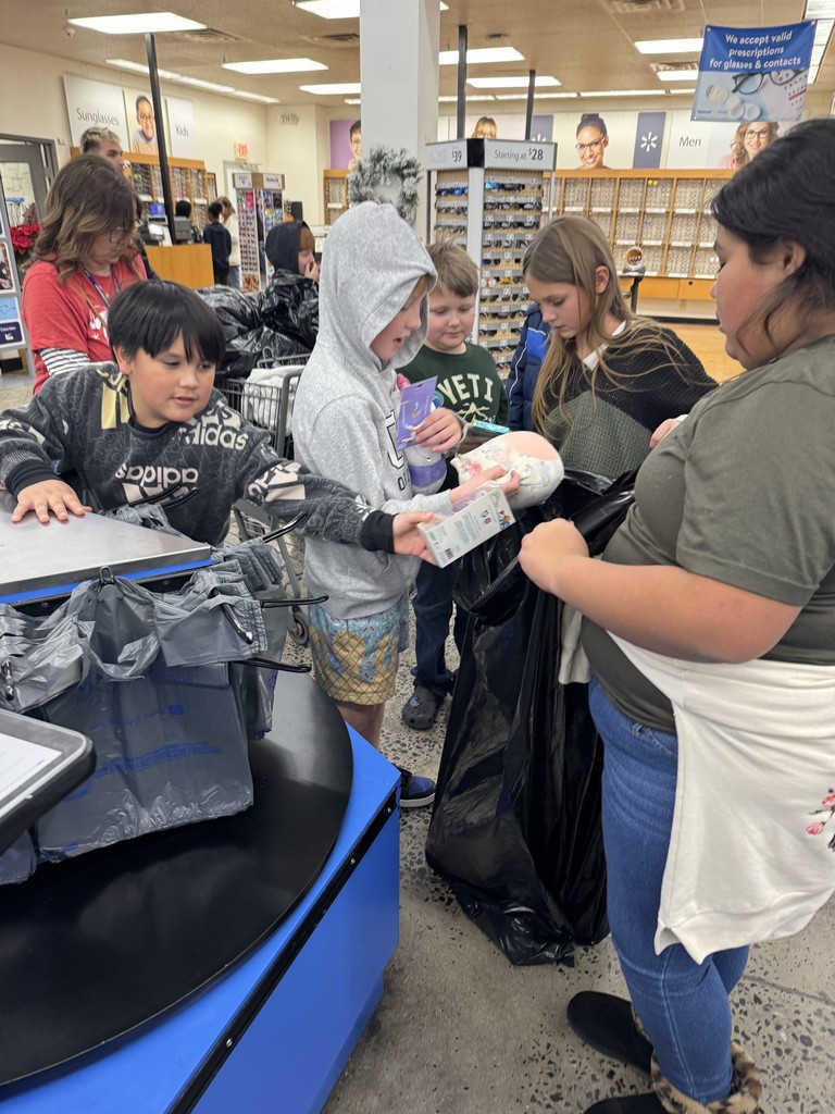 students checking out at walmart