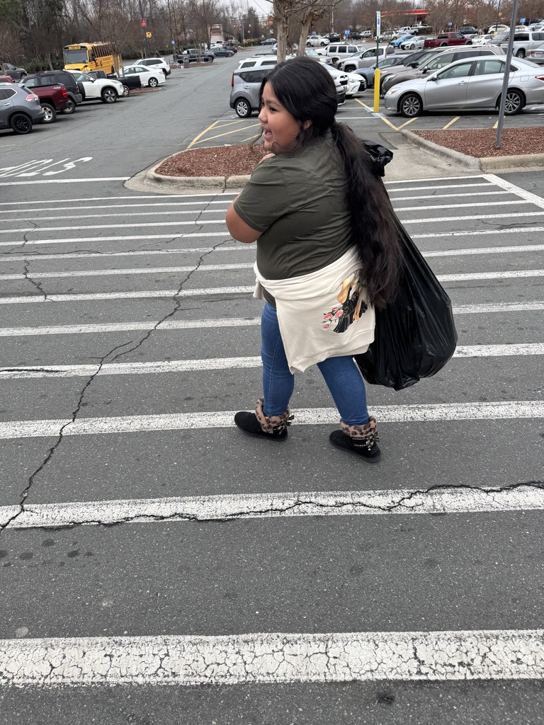 student walking through the walmart parking lot