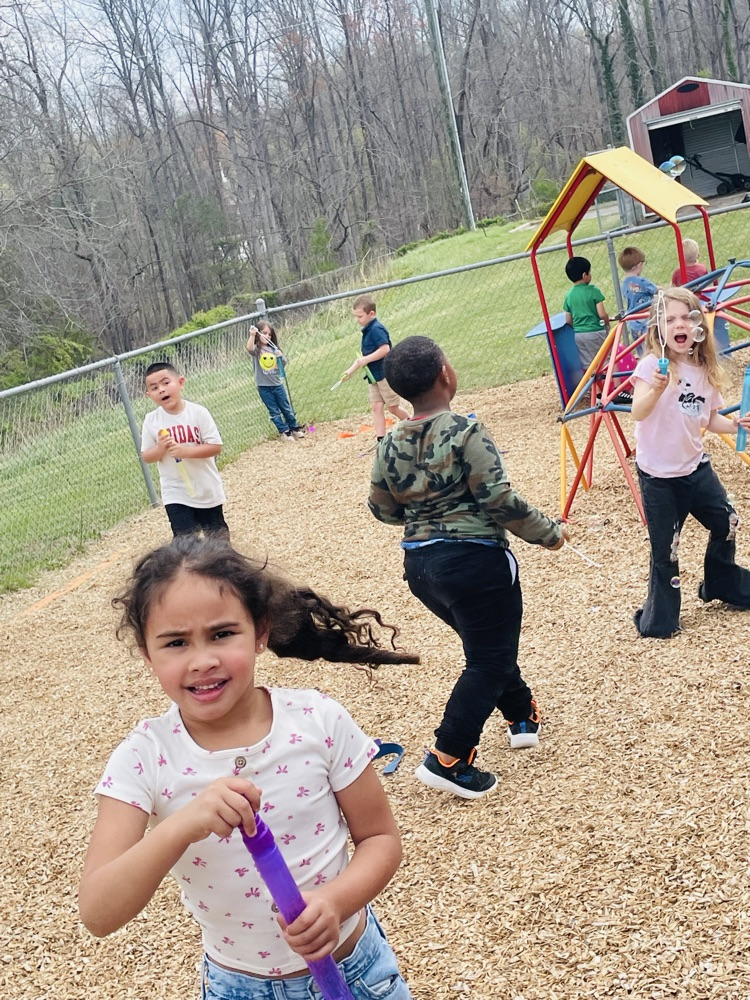 kids blowing bubbles