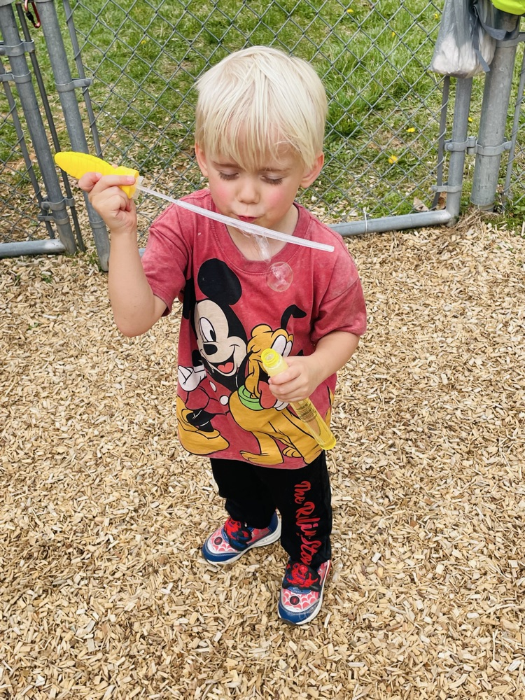 kid blowing bubbles