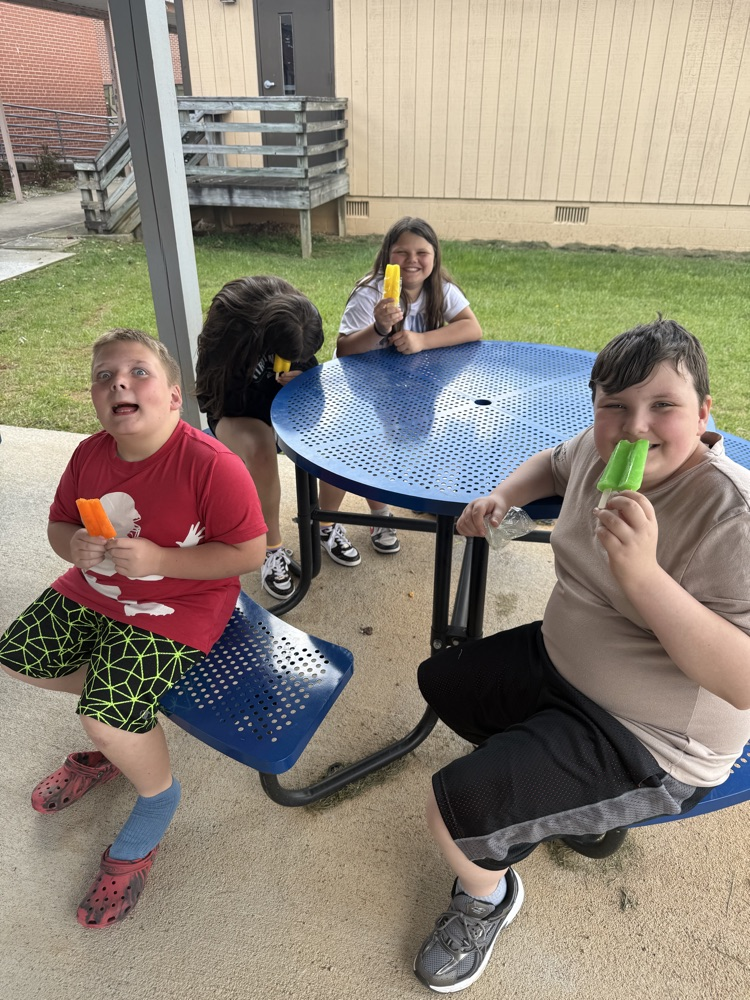 students enjoying popsicles outside