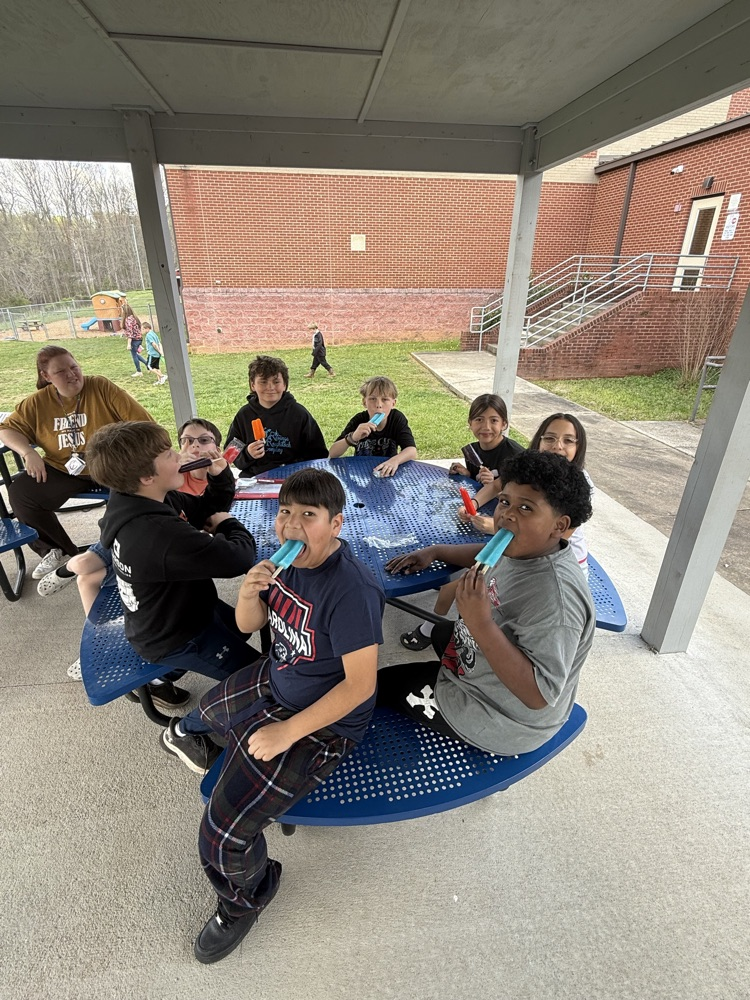 students enjoying popsicles outside