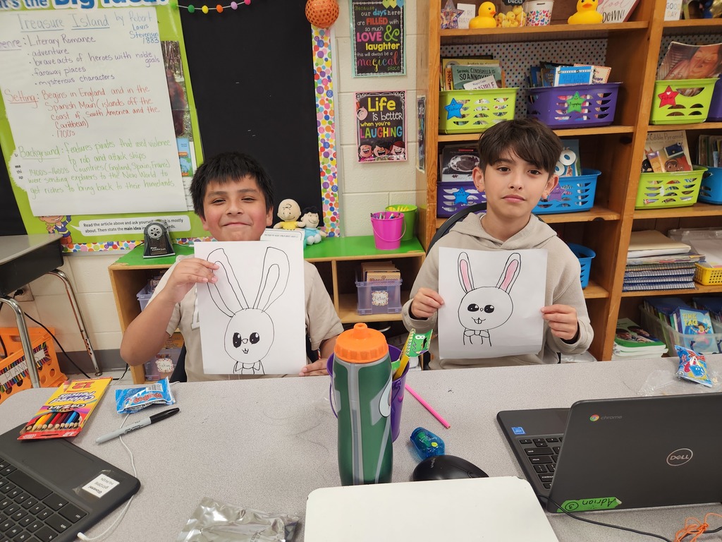 student showing off their Easter Bunny drawing