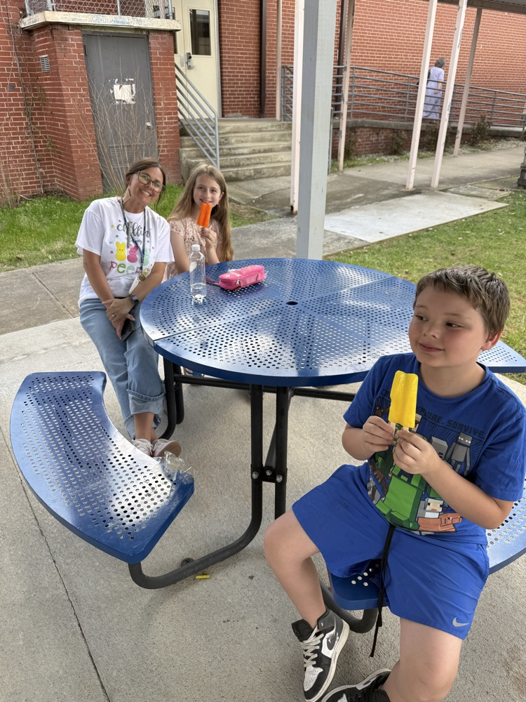 students enjoying popsicles outside 
