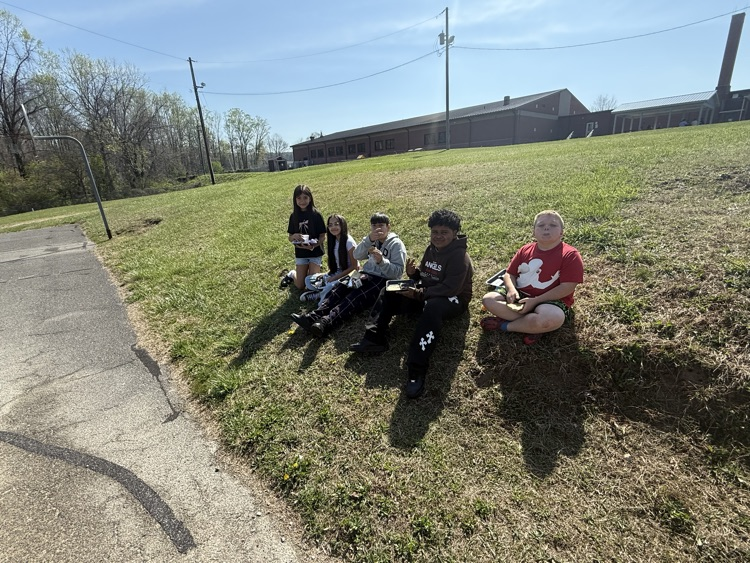 students enjoying popsicles outside