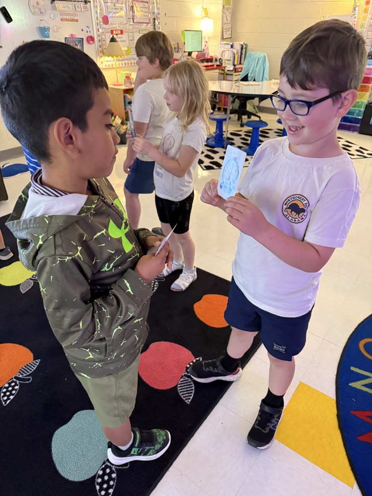 students practicing telling time