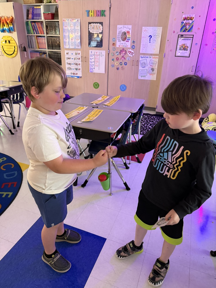 students practicing telling time