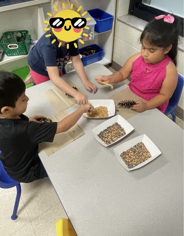 students making bird feeders