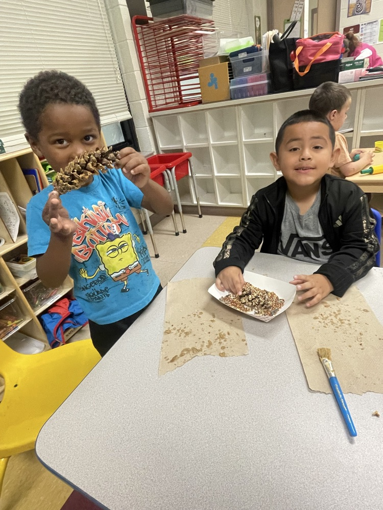 students making bird feeders