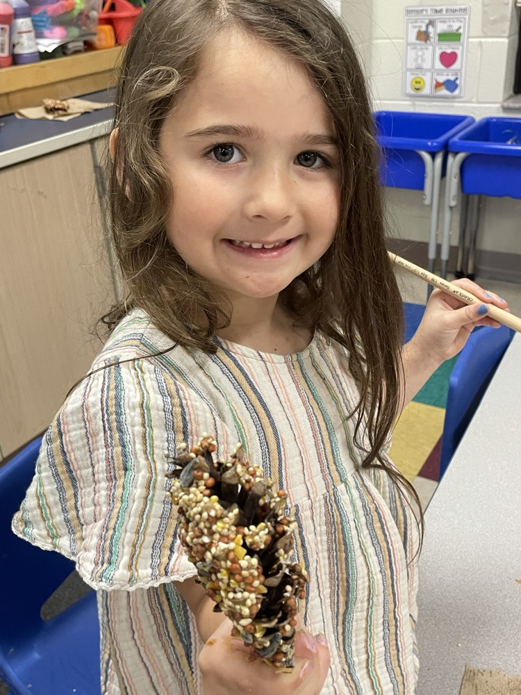 students making bird feeders 