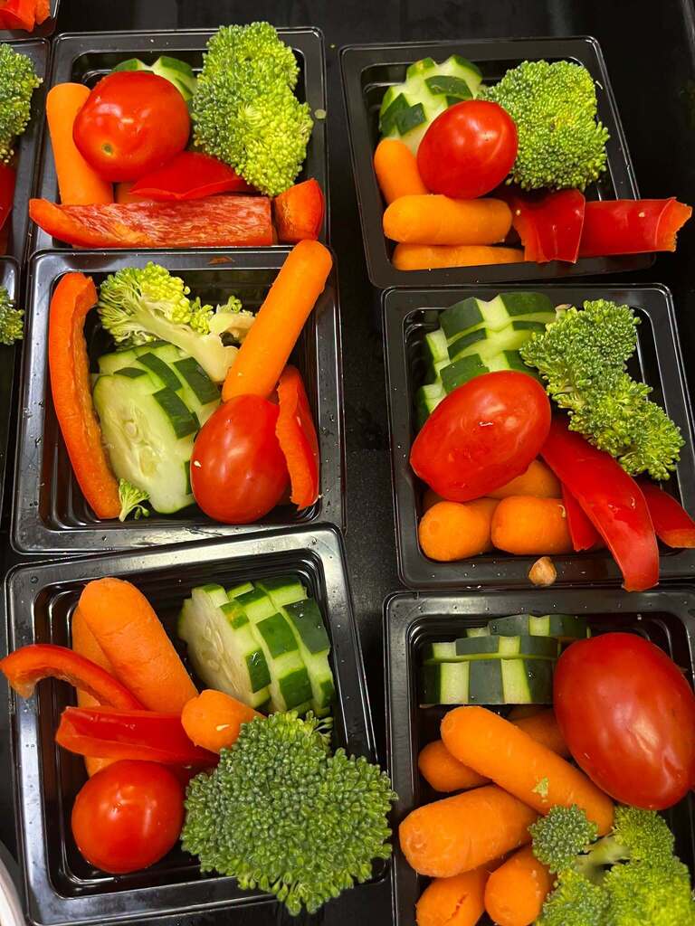Veggie trays portioned out for school lunch