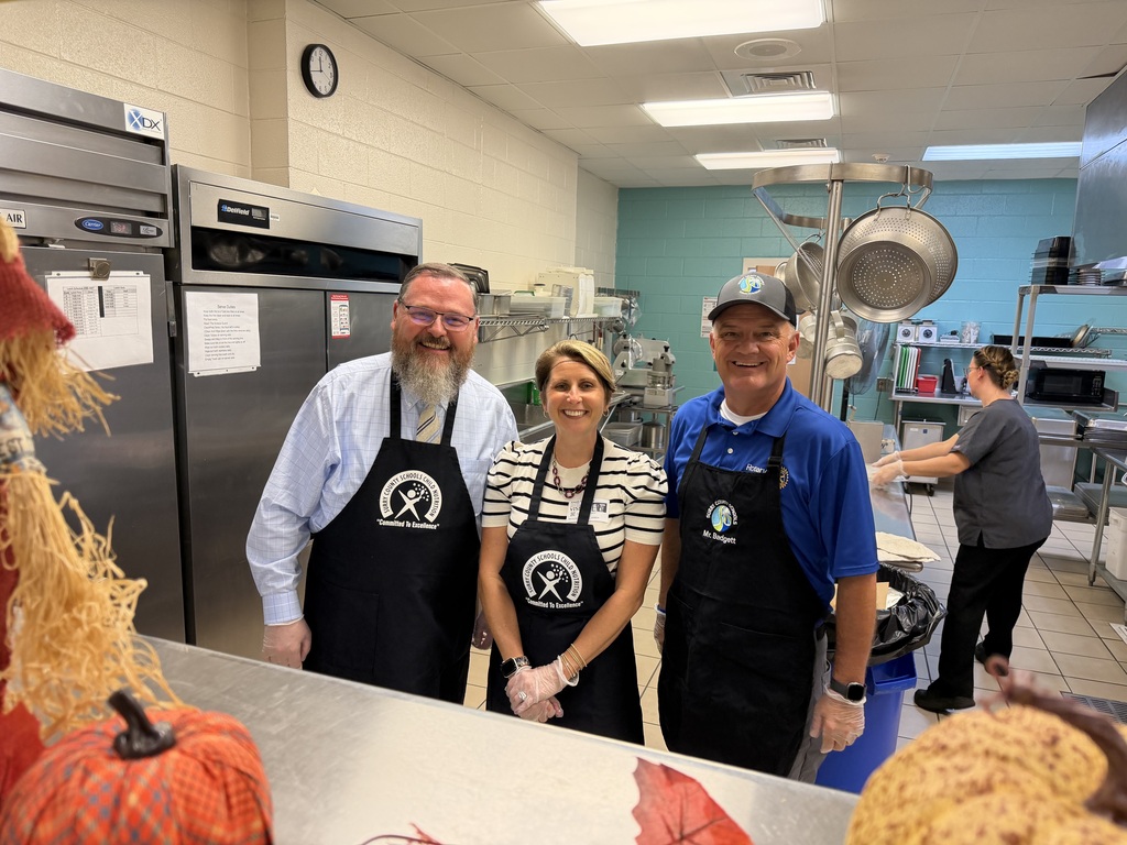Dr. Hall and members of the School Board help to serve lunch