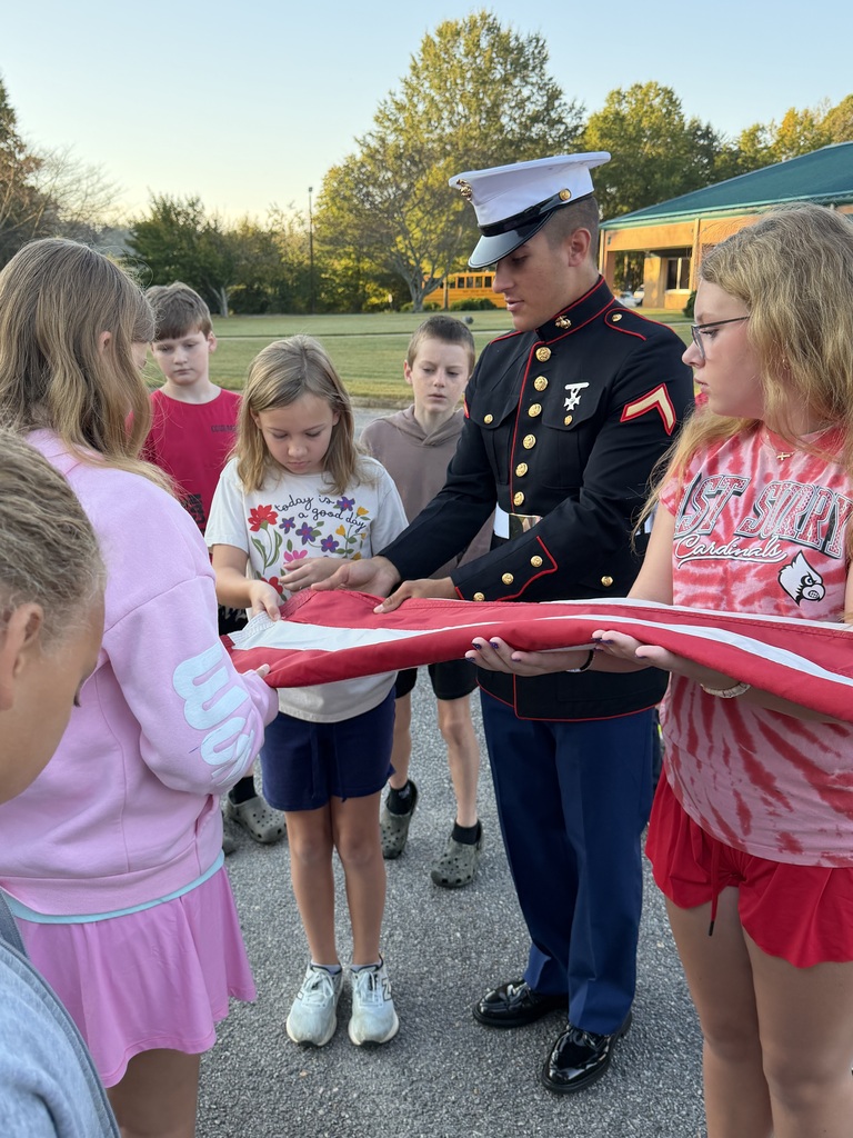 Private First Class Youngblood teaches 5th grade how to properly fold the flag!