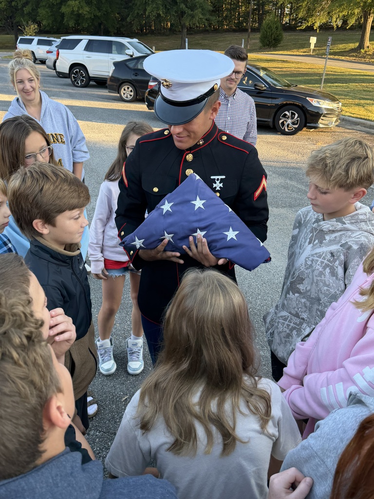 Private First Class Youngblood teaches 5th grade how to properly fold the flag!