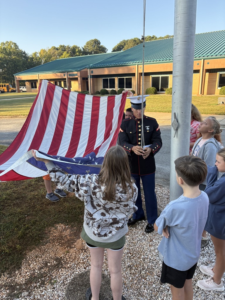 Private First Class Youngblood teaches 5th grade how to properly fold the flag!