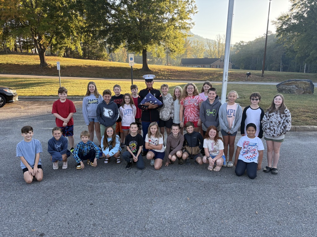 Prive Frist Class Youngblood teaches 5th grade how to properly fold the flag!