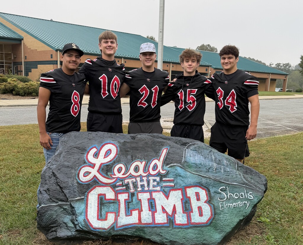 East Surry Football players visit Shoals Elementary