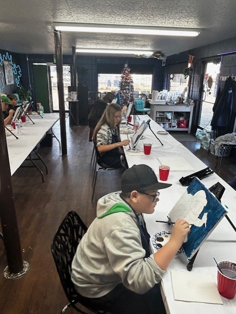 Keegan painting away.