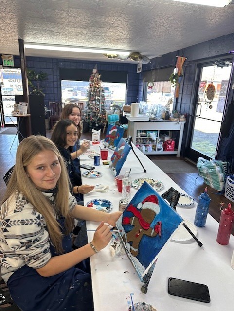 Oliva, Malia and Kelsie smile for the camera.