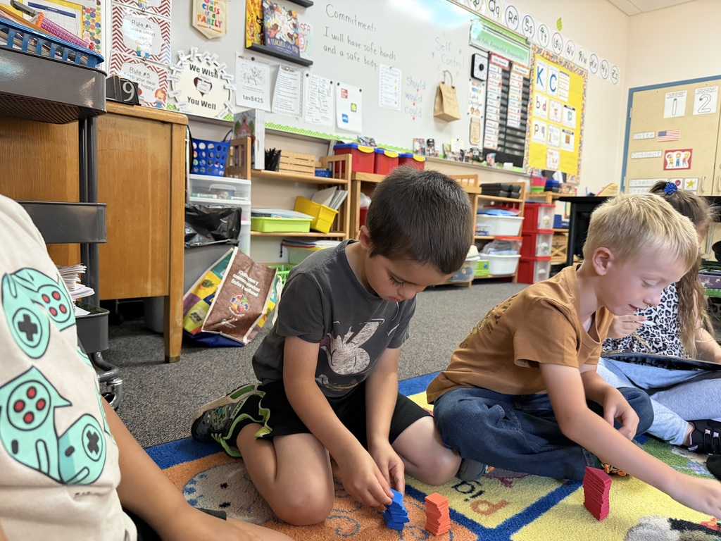 Photo of students playing with math manipulatives