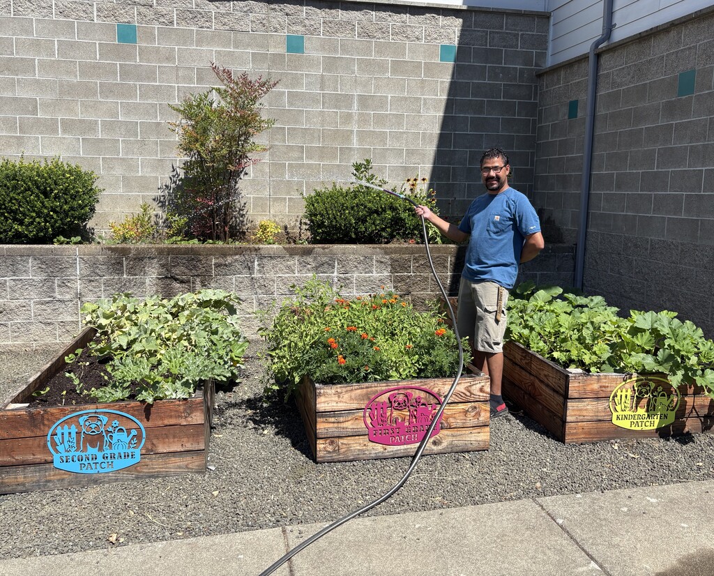Robert watering the Pup Patch