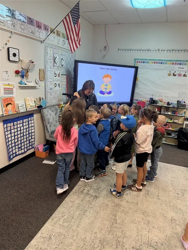 Mrs. Reigard loves her kindergarteners!