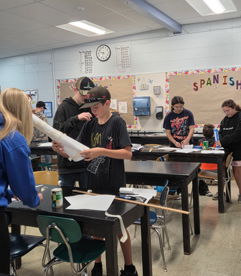 Students building paper towers