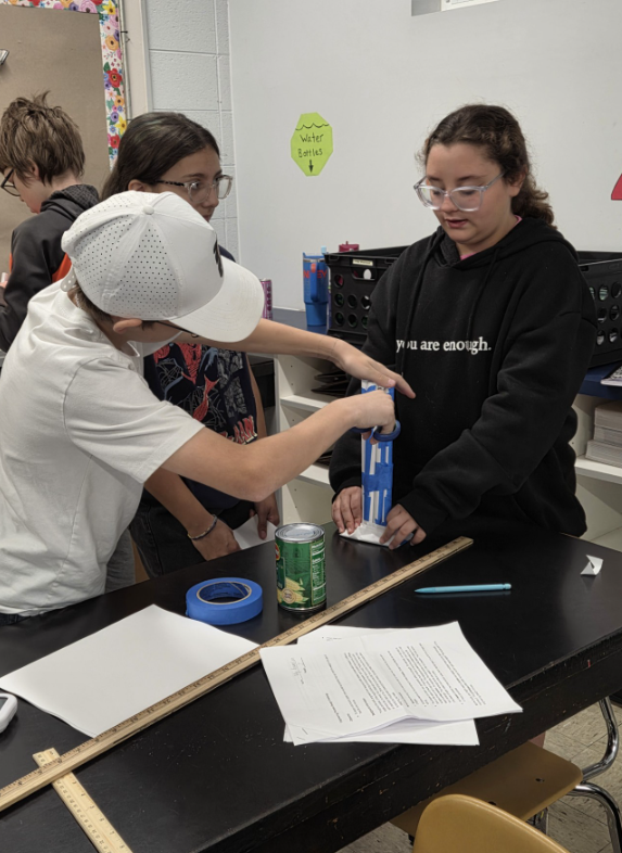 Students building paper towers