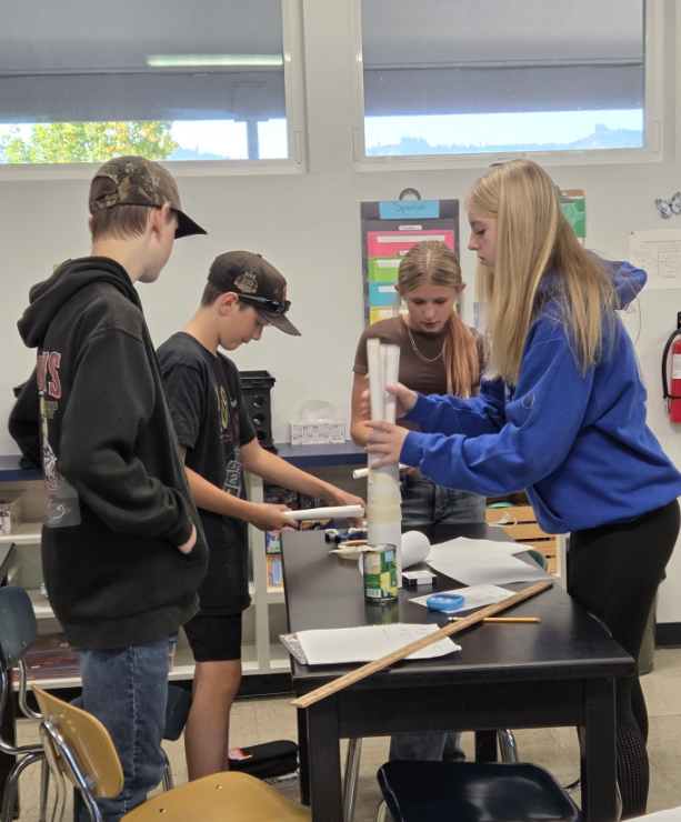 Students building paper towers
