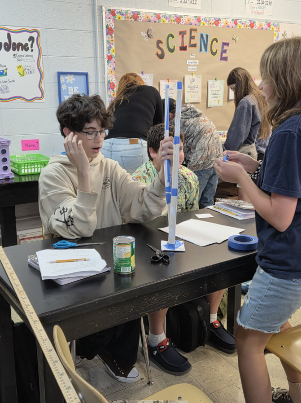 Students building paper towers