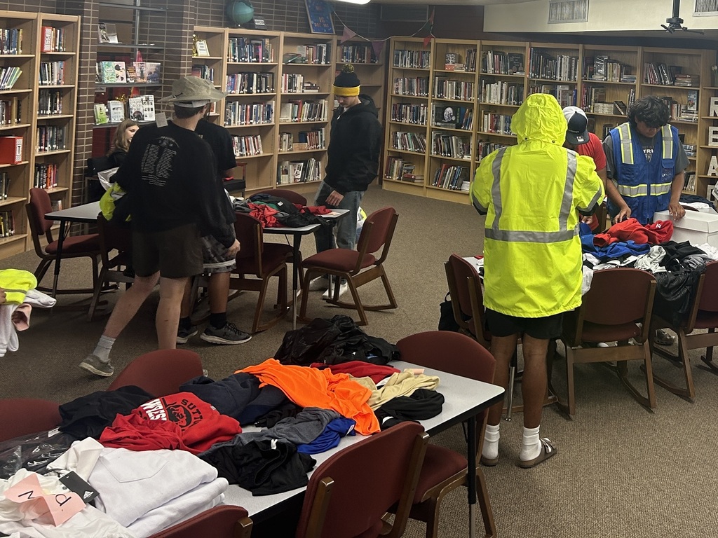 Photo of students selecting clothing