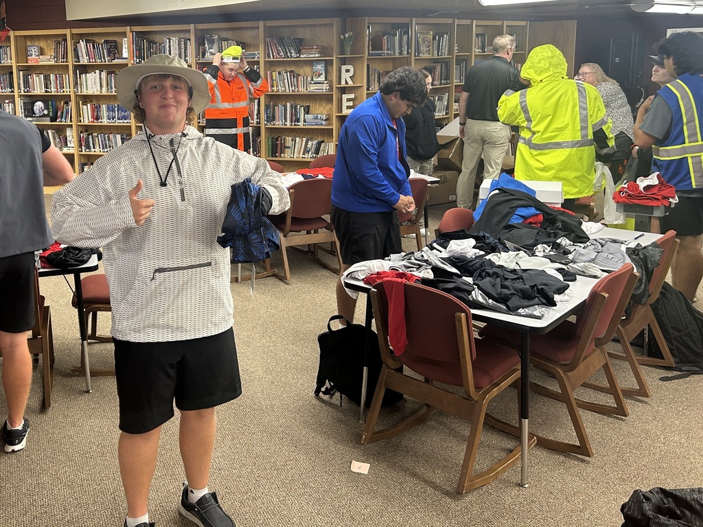 Photo of students selecting clothing