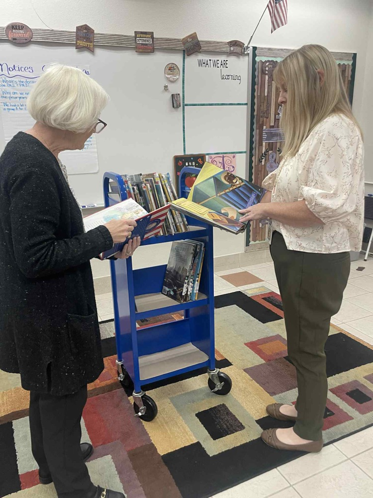  Mrs. Boggus and Mrs. Barrs sampling reading materials  