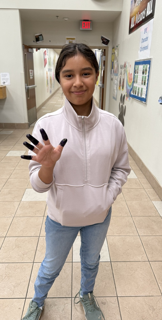 Fifth Grader showing off her purple fingers.