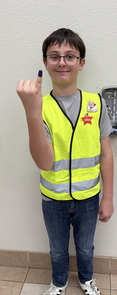 Fifth Grader showing off his Purple Pinkie